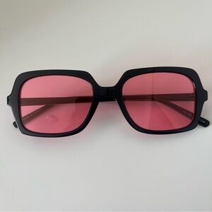 Black Frame Sunglasses with Pink Lenses from Urban Outfitters